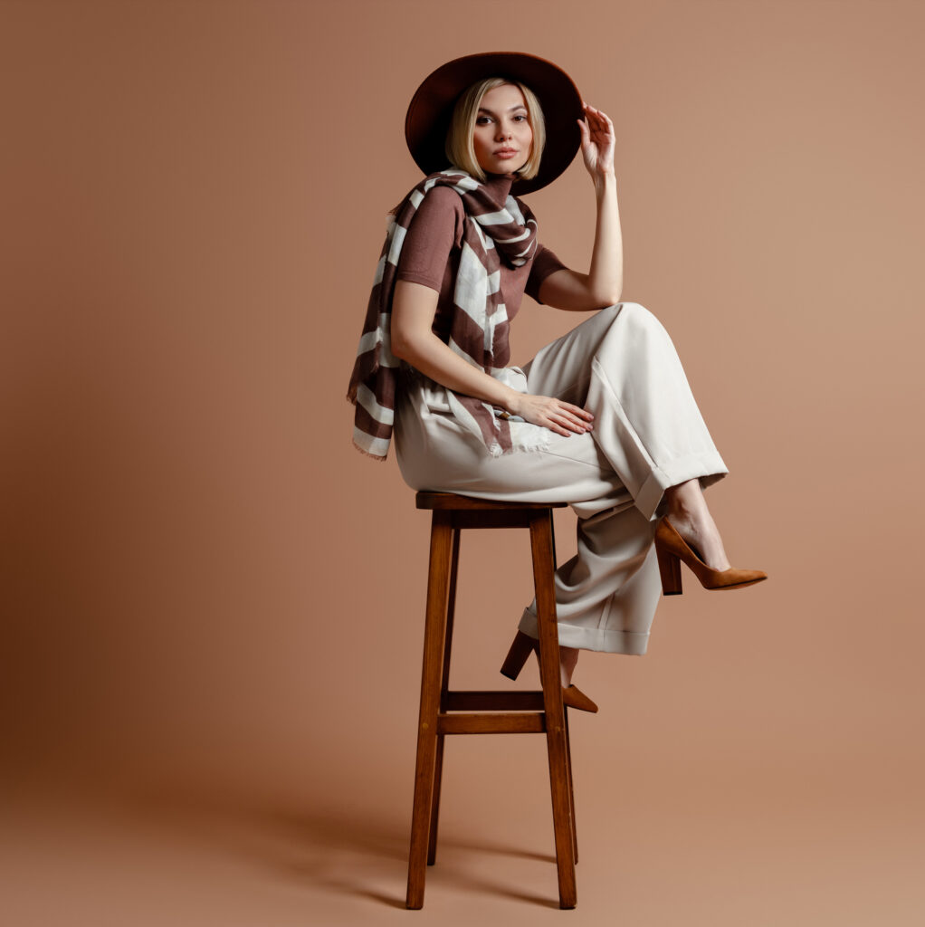 fashionable-young-woman-adjusting-her-elegant-hat-2026-01-09-06-38-42-utc